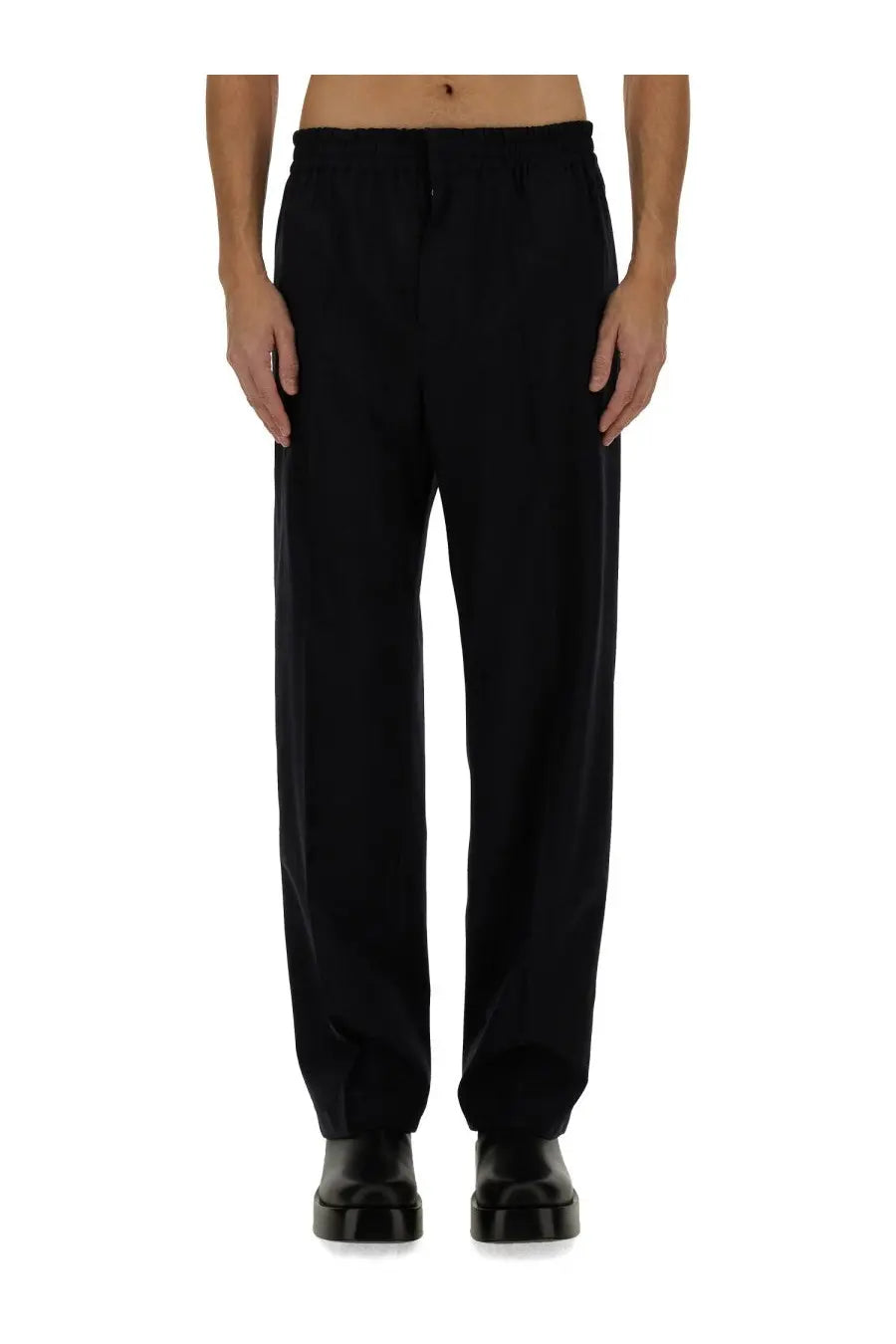 Black tailored wool trousers with relaxed fit and subtle pleats at waistband from bottega veneta mens blue pants