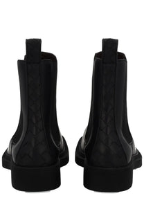 Bottega Veneta women’s chelsea boots in black glossy leather with signature intrecciato woven side panels
