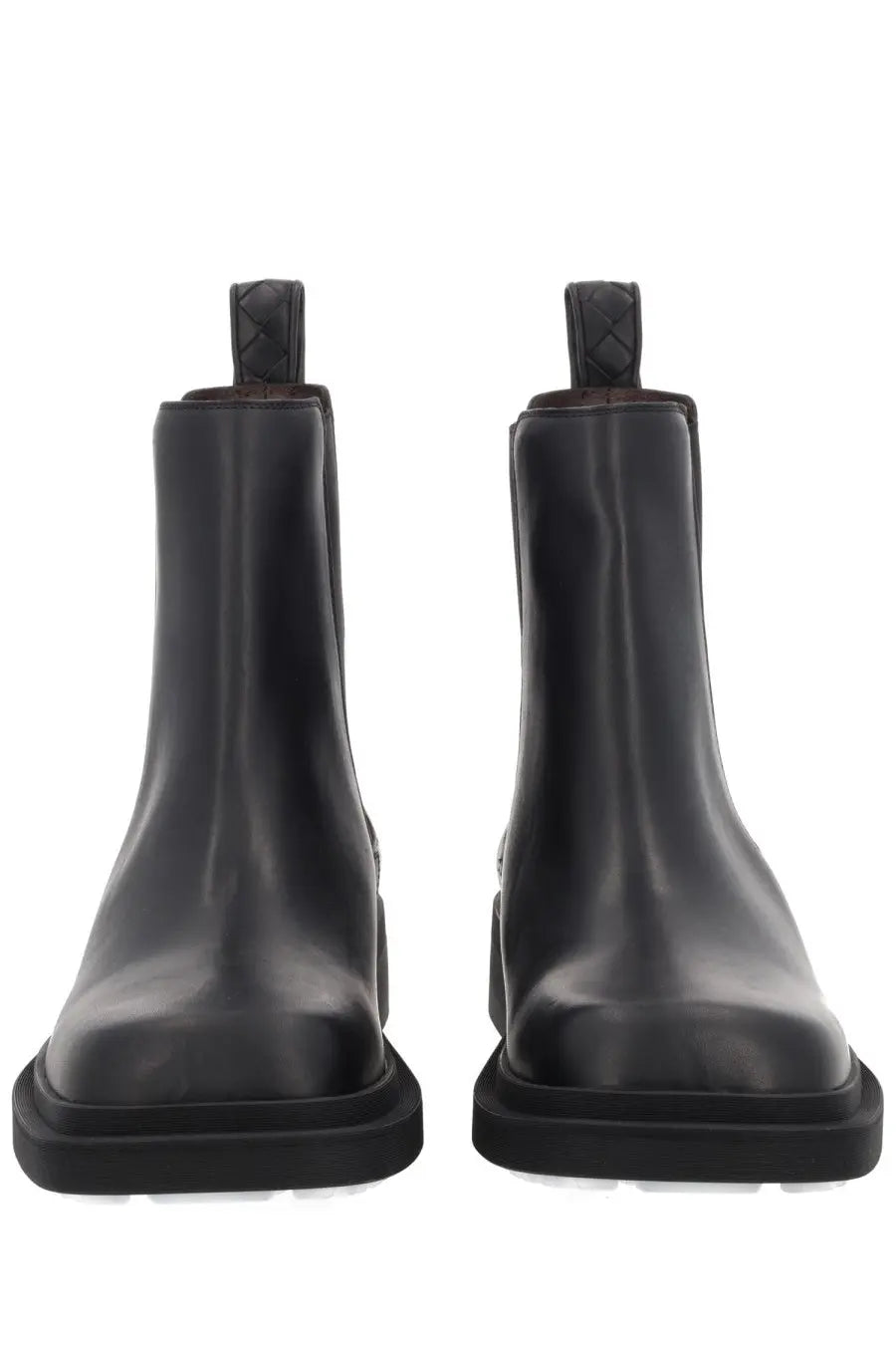 Bottega Veneta women’s black leather Chelsea boots with chunky sole and braided pull tabs front view