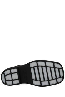 Black rubber sole with white traction blocks on bottega veneta women’s boot chelsea ben black minimalist design