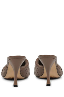 Bottega Veneta women’s brown woven leather mule shoe blink with sleek high heel and black tipped sole front view