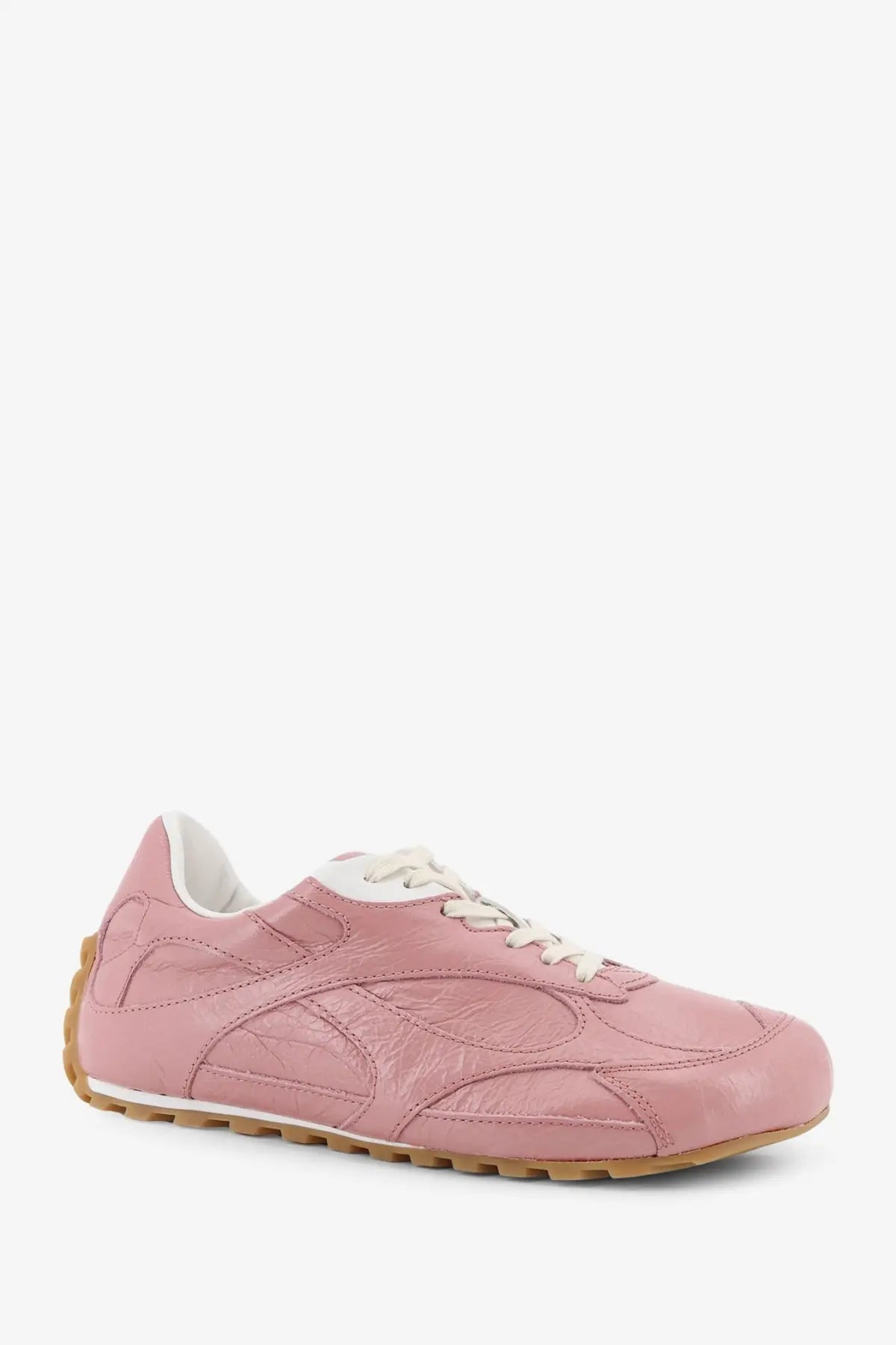 Bottega Veneta women’s orbit flash leather sneaker in pink with white laces and tan rubber sole
