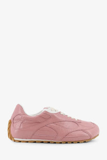 Bottega Veneta women’s orbit flash leather sneaker in pink with white laces and tan rubber sole