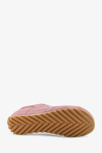 Pink suede Bottega Veneta women’s orbit flash sneaker with beige tan rubber sole and chevron tread pattern