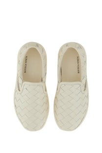 Cream-colored Bottega Veneta women’s Sawyer loafers with signature intrecciato woven leather pattern