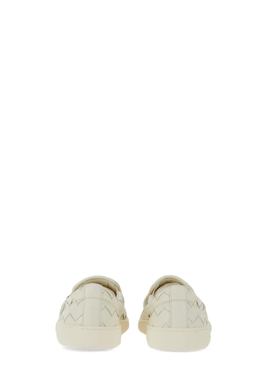Cream-colored bottega veneta women’s sawyer sneaker in woven leather with a minimalist slip-on design