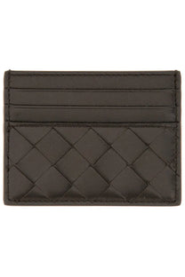Dark brown leather card holder with woven pattern and precise stitching by Bottega Veneta for women