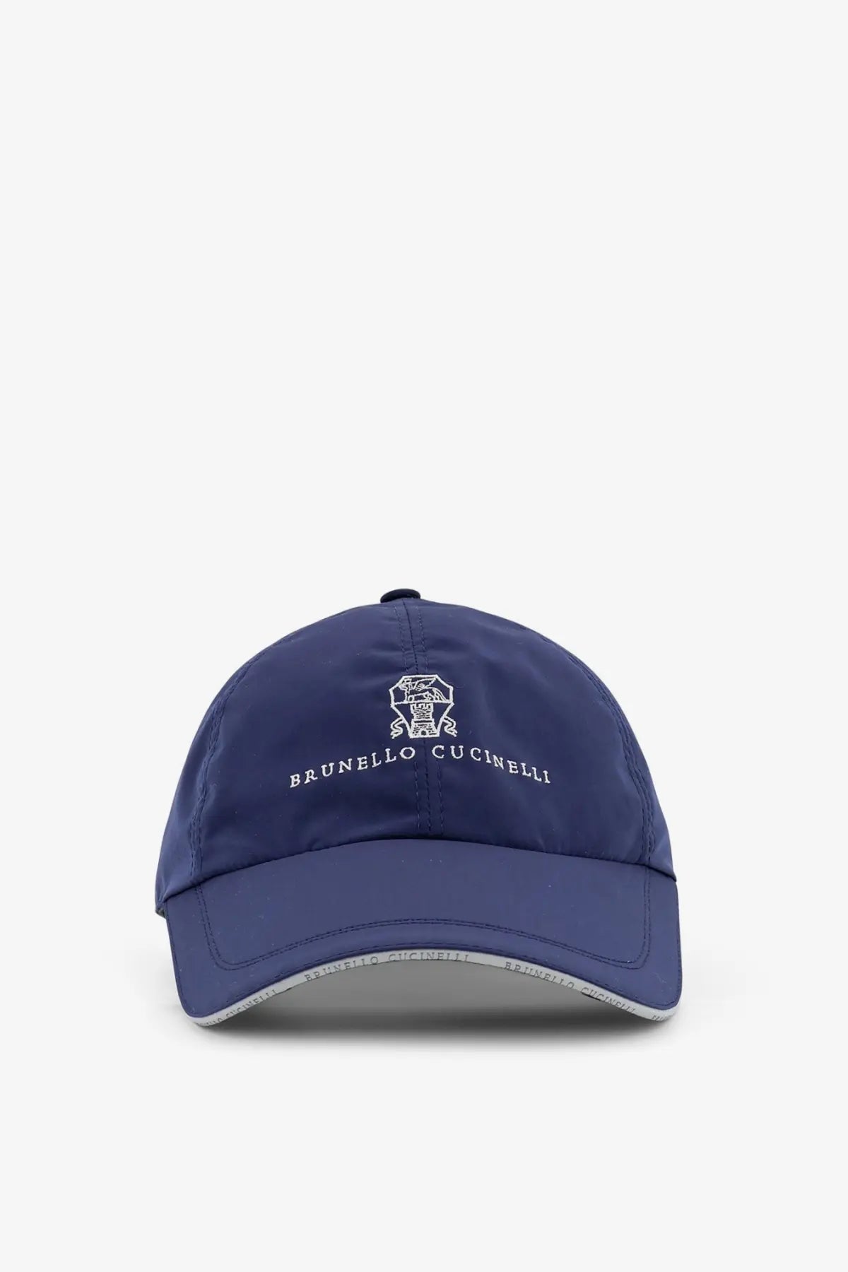 Navy blue Brunello Cucinelli men’s baseball hat with white embroidered logo and brand name on the front