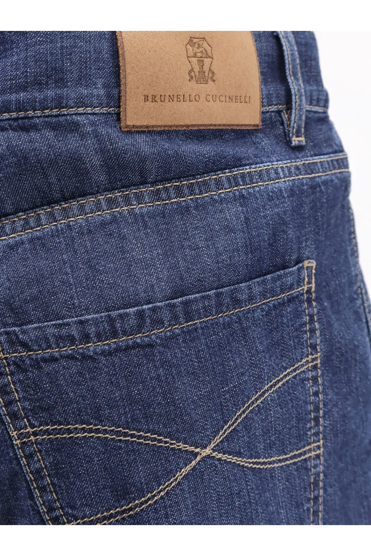 Dark blue cotton denim jeans with tan leather brunello cucinelli logo patch on the back side