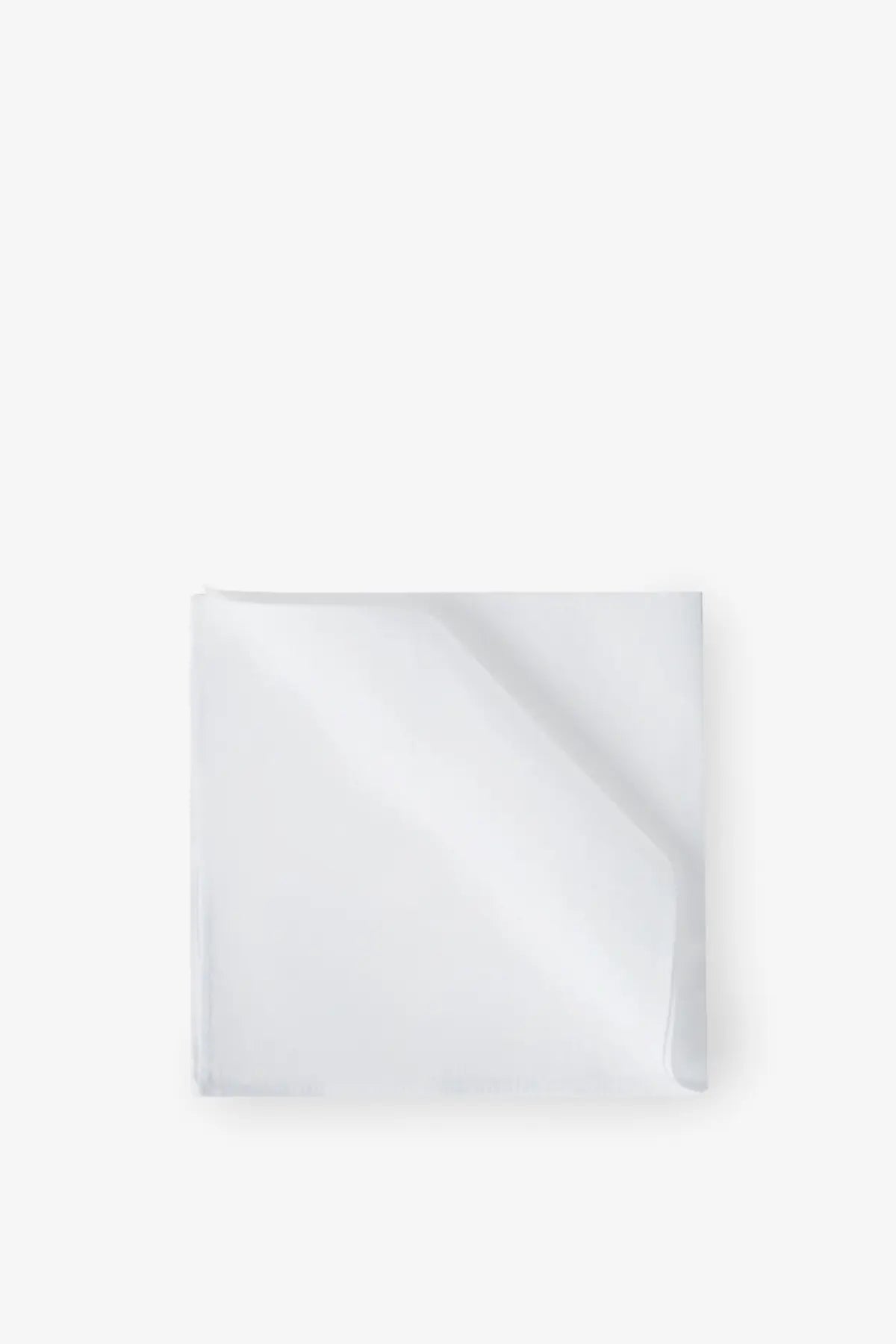 A crisp white cotton pocket square by brunello cucinelli neatly folded with subtle sheen and clean edges