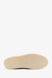 Beige rubber sole with subtle tread pattern and embossed logo on brunello cucinelli men’s leather sneakers