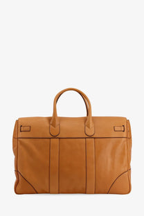 Tan leather Brunello Cucinelli men’s travel bag with top handles and structured vertical stitching