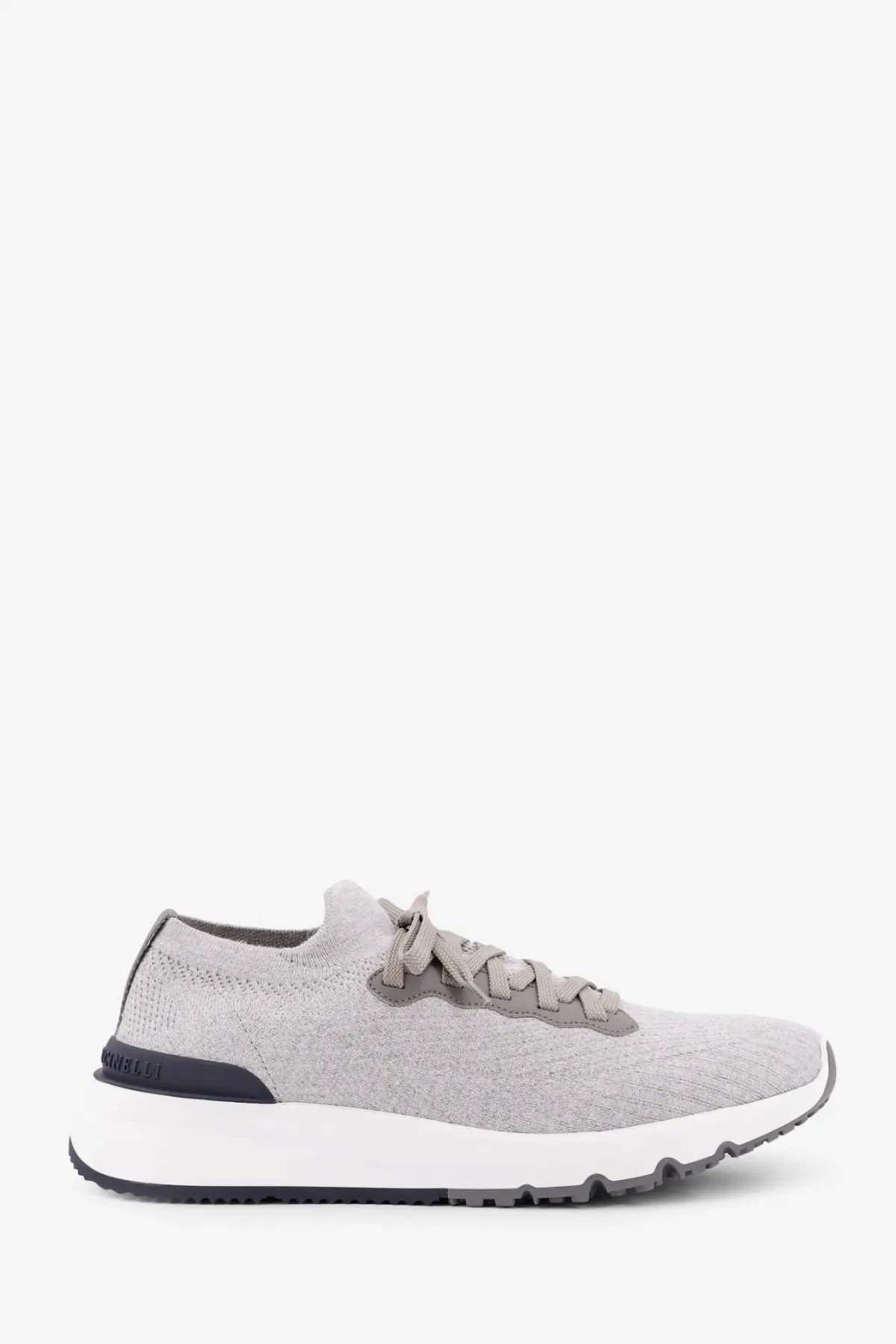 Back view of brunello cucinelli men’s low top gray knit sneaker with white midsole black outsole and subtle heel branding