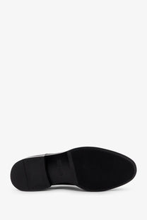 Black rubber sole with textured grip pattern and embossed brunello cucinelli logo on men’s oxford patent leather lace black
