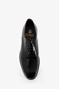 Brunello Cucinelli men’s black patent leather oxford shoe with polished finish and classic lace-up design