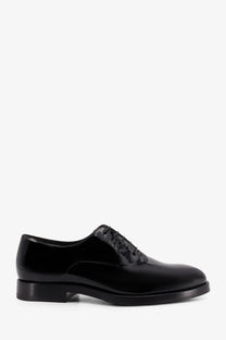 Brunello Cucinelli men’s black patent leather oxford shoe with polished finish and classic lace-up design