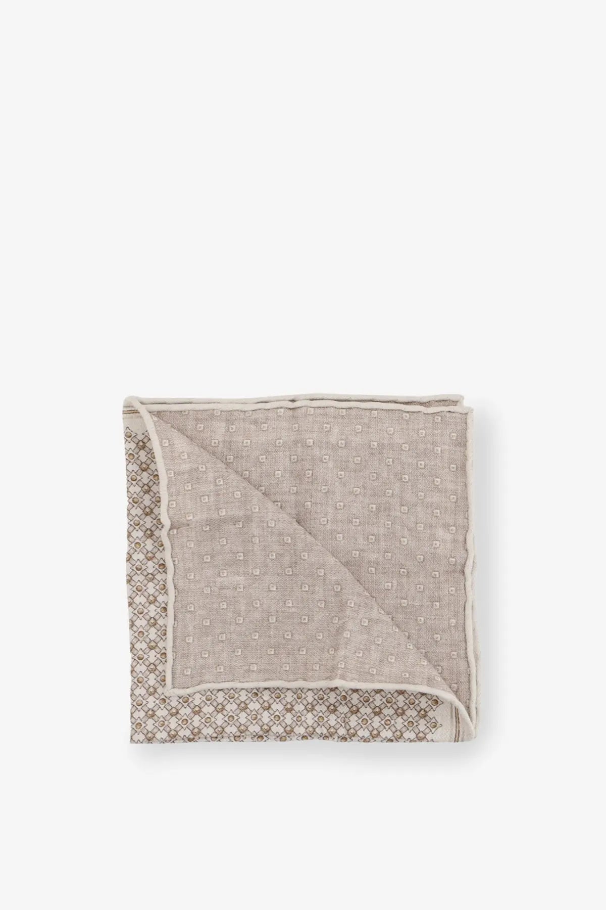 A neatly folded brunello cucinelli men’s beige silk pocket square with a subtle geometric pattern and dark gray border