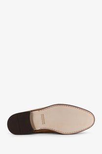 Tan leather brunello cucinelli men’s dress shoe with dark brown rubber sole and stitched lining