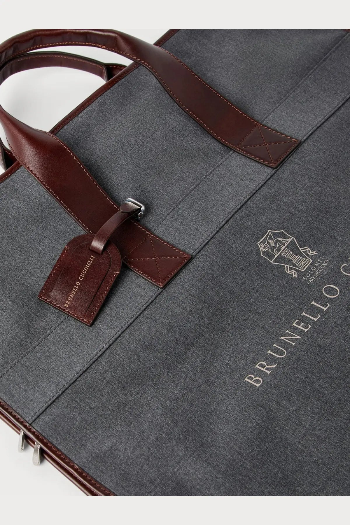 Brunello Cucinelli men’s grey garment bag with dark gray textured canvas and brown leather handles and trim