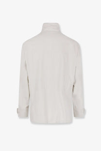 Brunello Cucinelli men’s waterproof off-white turtleneck jacket with minimalist design and subtle seam detailing