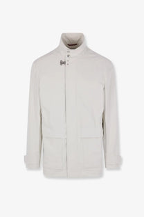 Brunello Cucinelli men’s waterproof sahariana white jacket with high collar silver clasps and patch pockets in smooth fabric