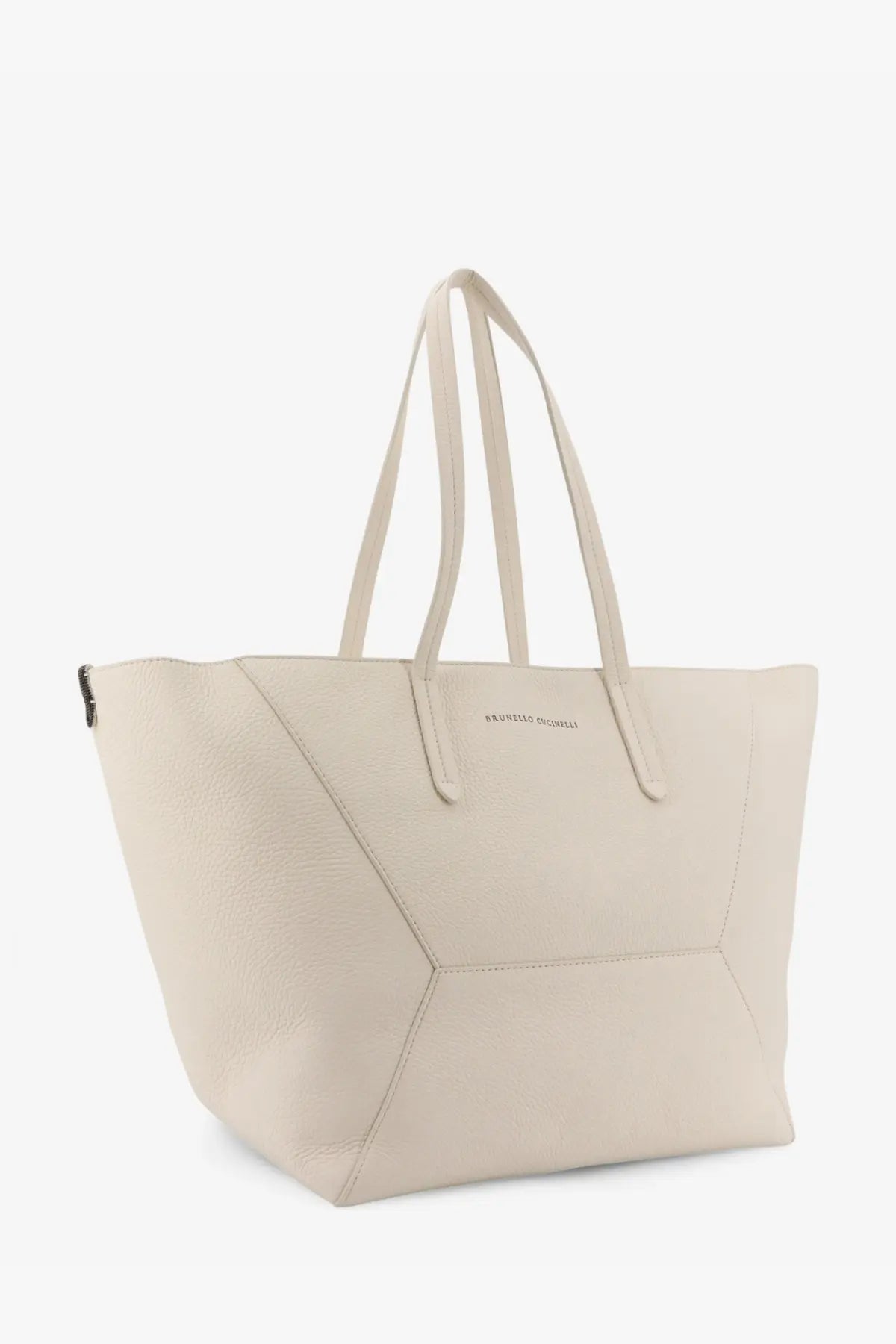 Cream-colored leather tote bag with geometric stitching and dual top handles from Brunello Cucinelli women’s collection