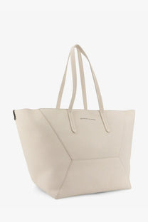 Cream-colored leather tote bag with geometric stitching and dual top handles from Brunello Cucinelli women’s collection