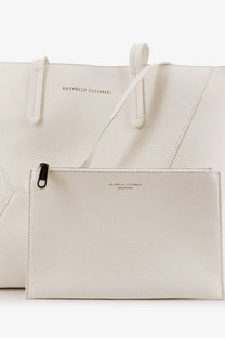 A sleek white leather clutch from Brunello Cucinelli with minimalist design and black zipper pull