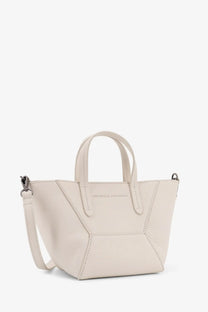 Cream-colored leather tote bag with geometric stitching and detachable shoulder strap by Brunello Cucinelli