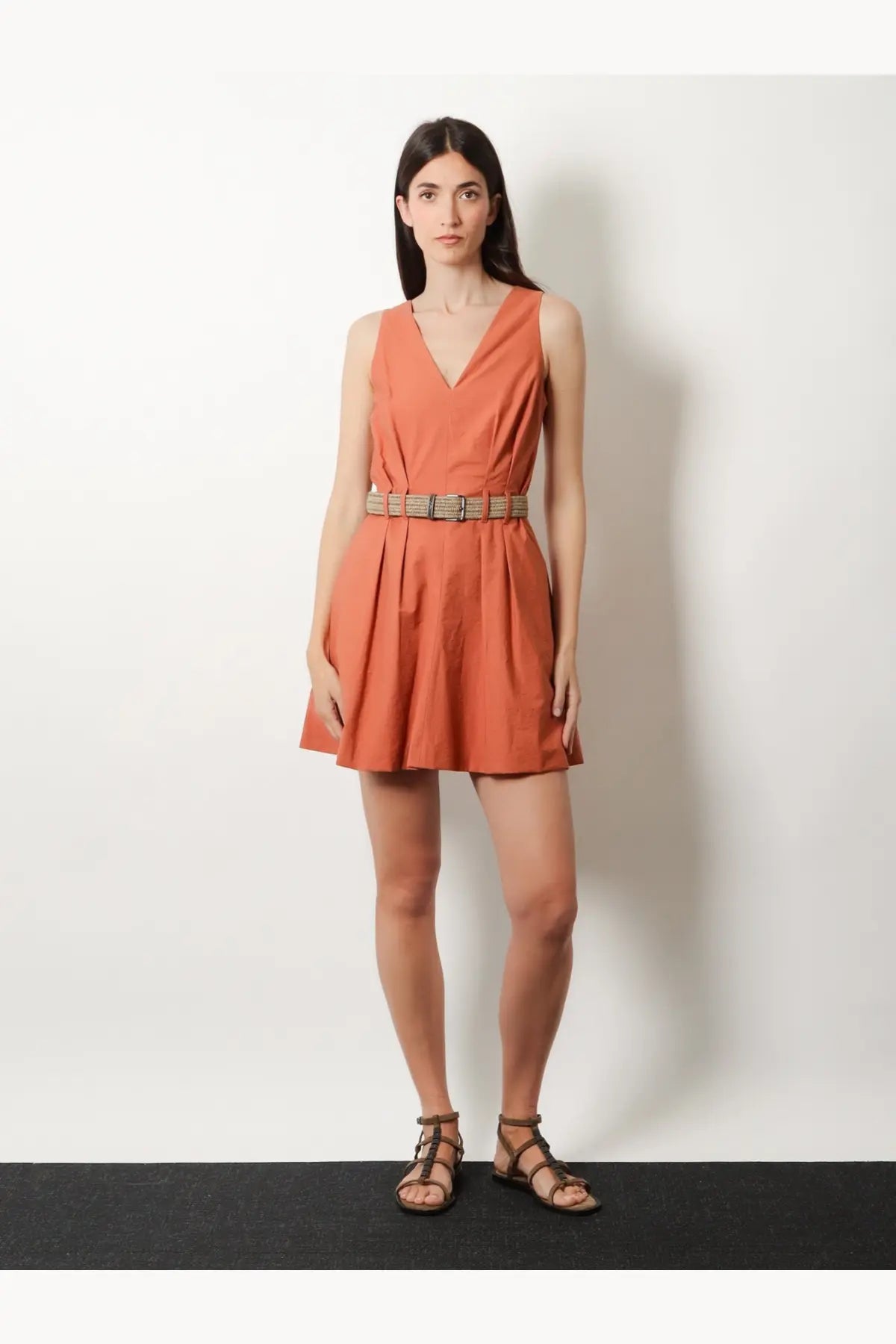 Brunello Cucinelli women’s beige mini dress with sleeveless v-neckline pleats and woven belt detail