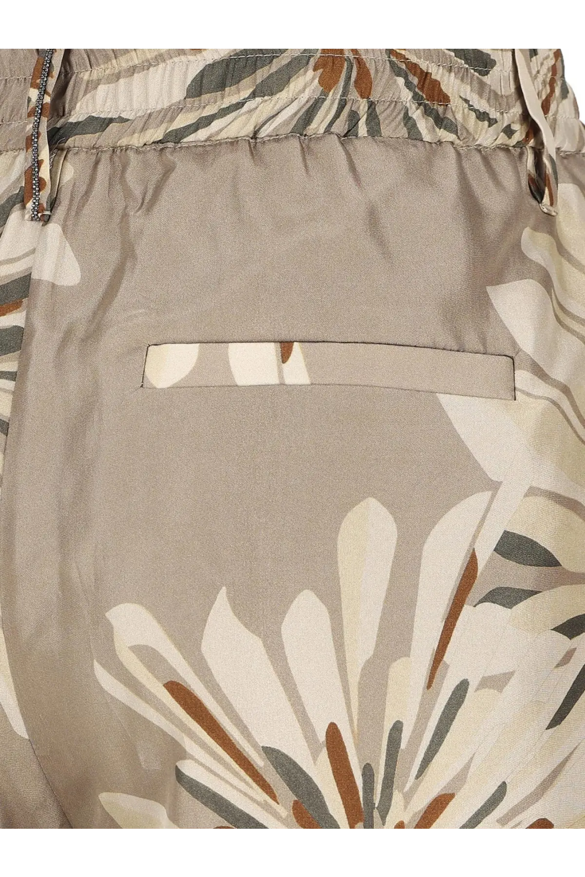 Beige floral-patterned shorts with drawstring waist and front pocket complementing brunello cucinelli green printed silk trousers