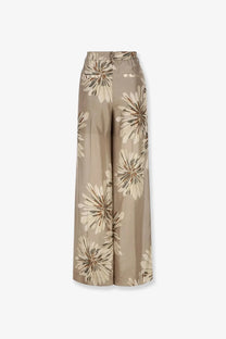 Beige wide-leg Brunello Cucinelli women’s printed silk trousers with a flowing cream and muted brown floral pattern