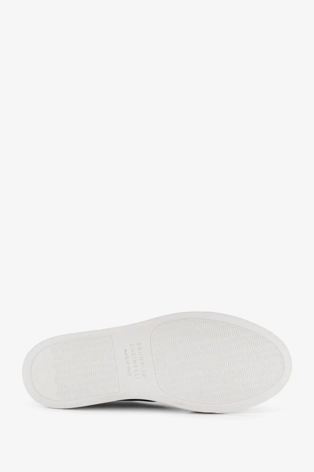 White rubber sole with textured grip pattern and embossed brand logo on brunello cucinelli women’s beige suede sneakers