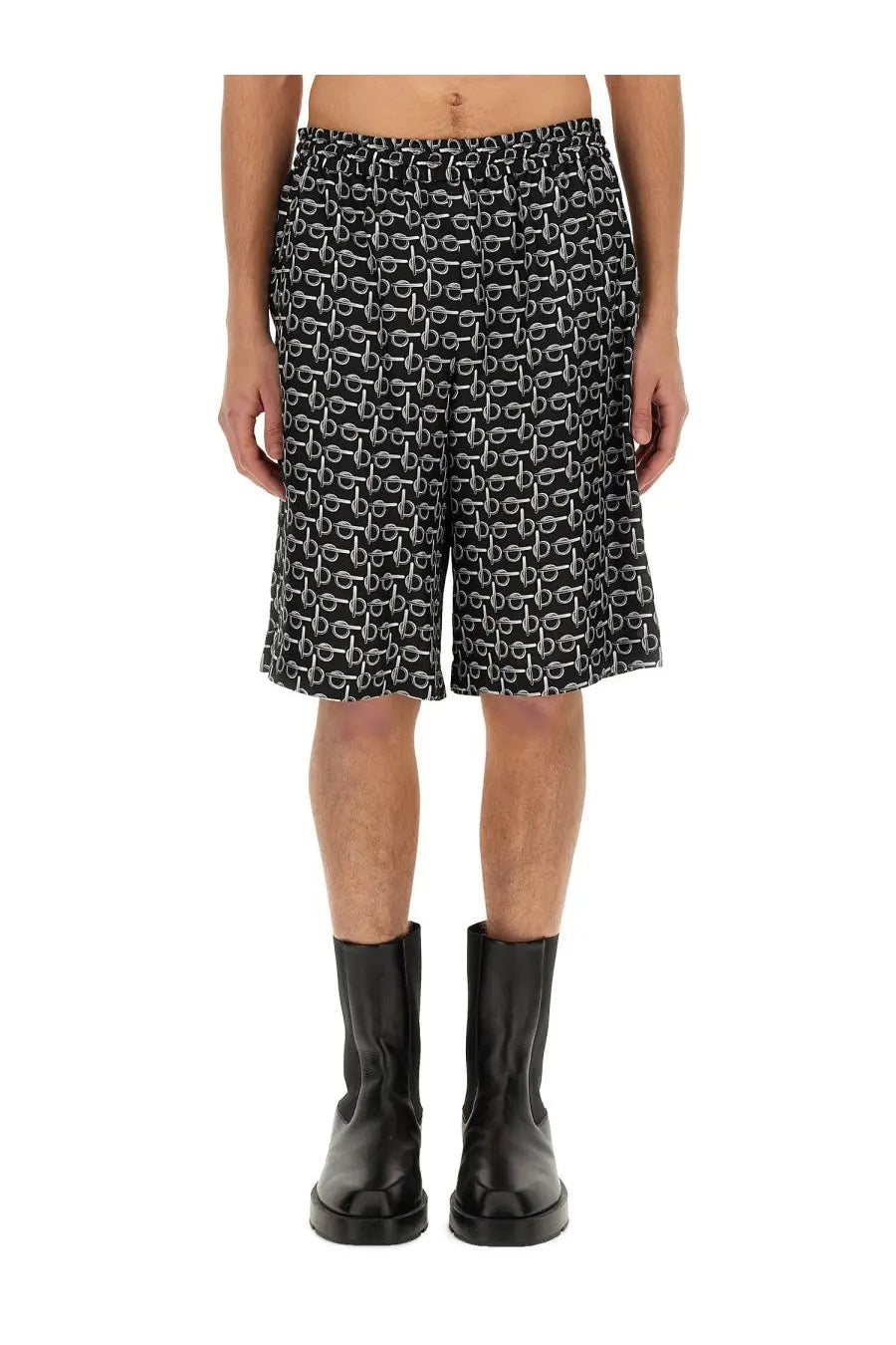 Burberry men’s black Bermuda shorts with repeating white chain-link pattern and lightweight fabric for casual wear