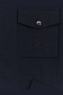 Dark navy burberry men’s bradmore nylon jacket pocket with silver button and subtle embroidered logo