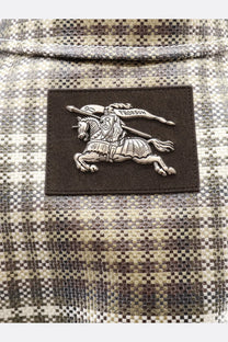 Silver embroidered knight patch on dark brown leather backing on burberry mens foxfield madras trench white plaid fabric