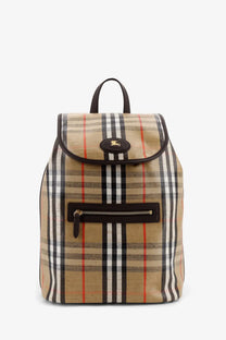 Burberry men’s Highlands beige plaid canvas backpack with black white and red pattern and brown leather trim with gold logo plaque