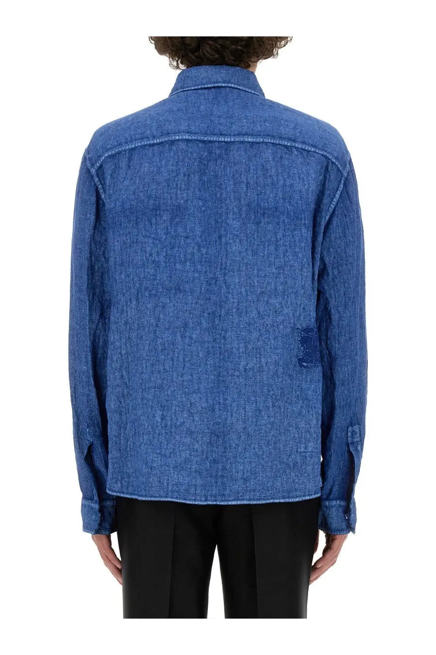 Burberry men’s blue linen shirt showing the back with subtle textured weave and intentional distressing