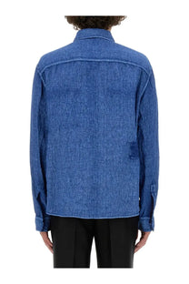 Burberry men’s blue linen shirt showing the back with subtle textured weave and intentional distressing