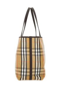 Burberry women’s beige black white and red plaid canvas tote bag with dark brown leather handles