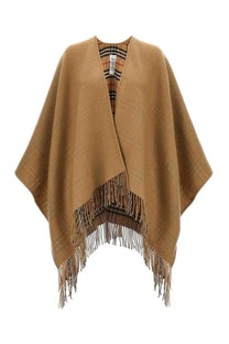 Burberry women’s reversible check wool cape beige with tan wool exterior and fringed edges showing checkered lining
