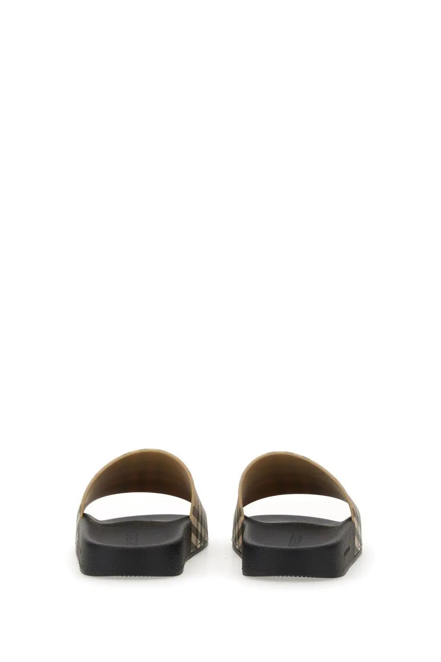 Burberry women’s slide sandals in beige with black pattern and textured sole for casual wear
