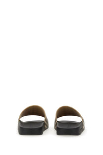 Burberry women’s slide sandals in beige with black pattern and textured sole for casual wear