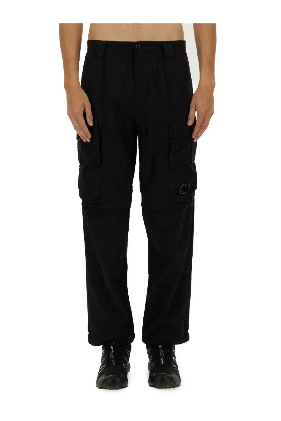 Cp company men’s black cargo pants with multiple pockets and subtle circular logo on the thigh