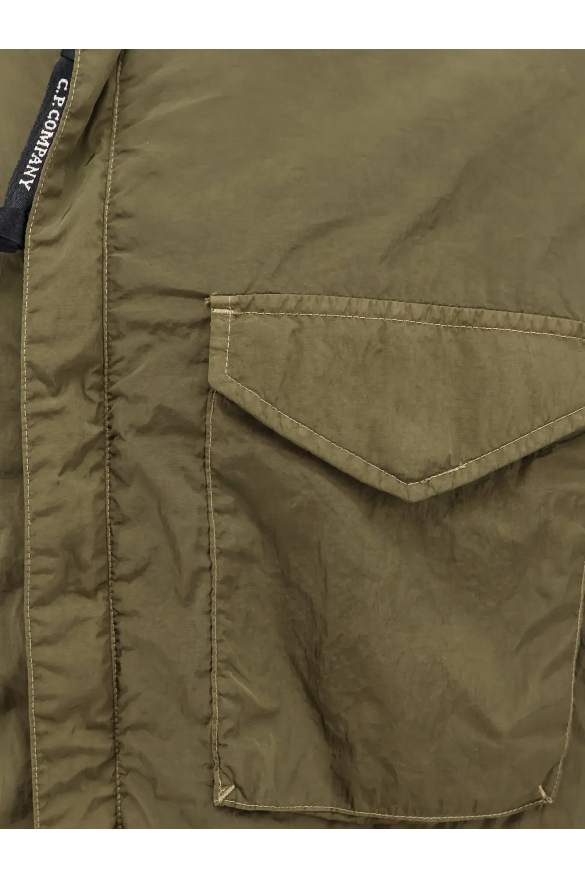 C.P. Company men’s olive green nylon shirt jacket with quilted texture and diagonal flap pocket with matching stitching