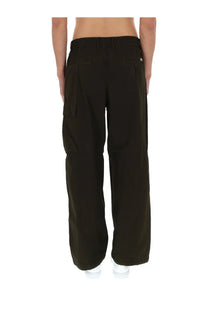 Black cargo pants with wide legs and multiple pockets by cp company in green for men