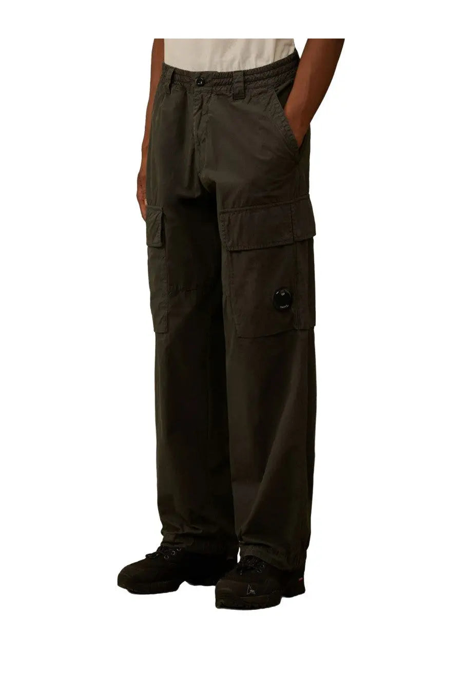 C.P. Company men’s pantalone cargo pants in contone green with multiple flap pockets and black button detail on thigh