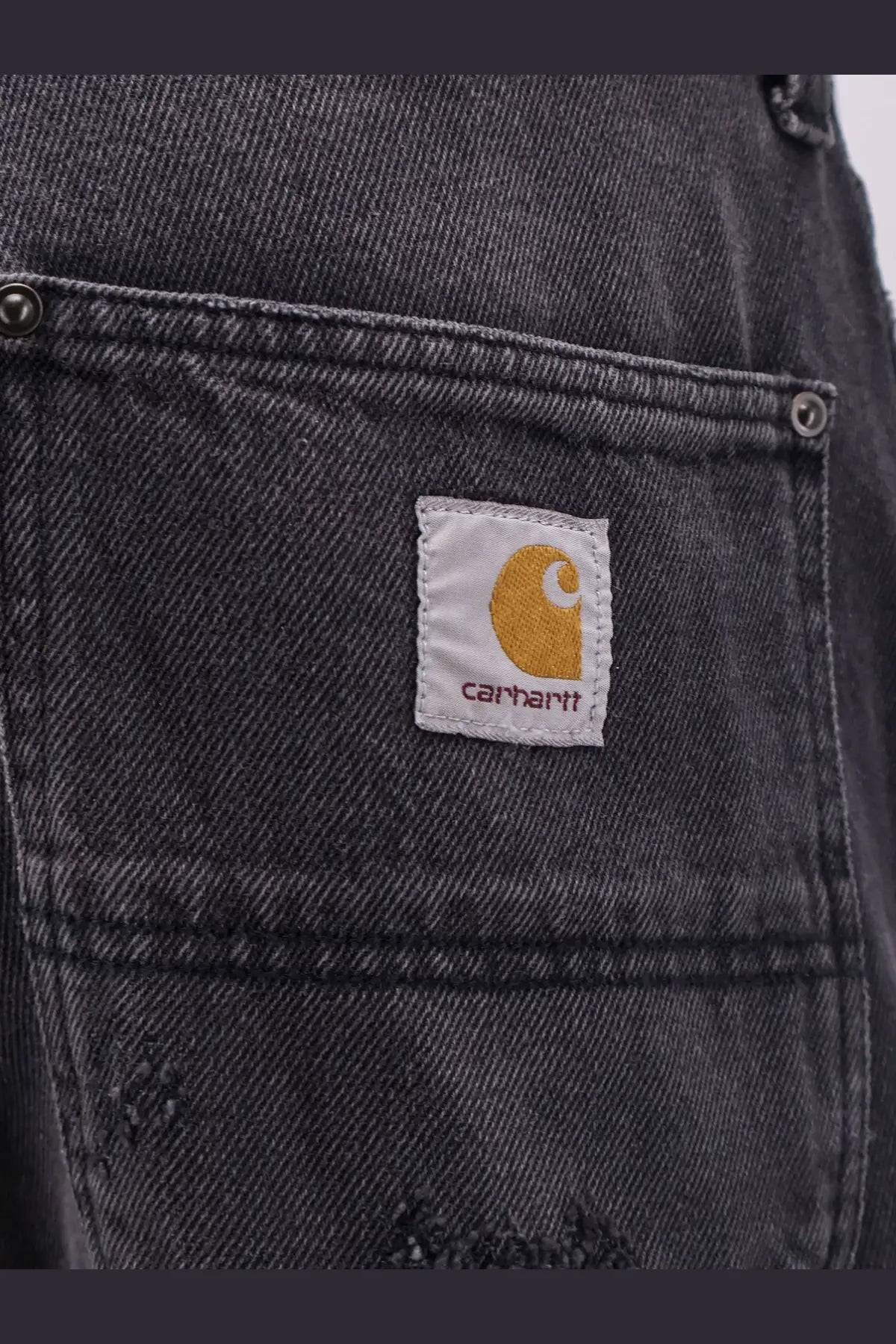 Carhartt wip men’s aden bradenton black distressed denim bermuda shorts with white patch and orange logo on back
