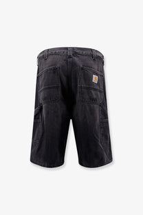 Back view of carhartt wip men’s aden bradenton black denim bermuda shorts with multiple pockets and logo patch