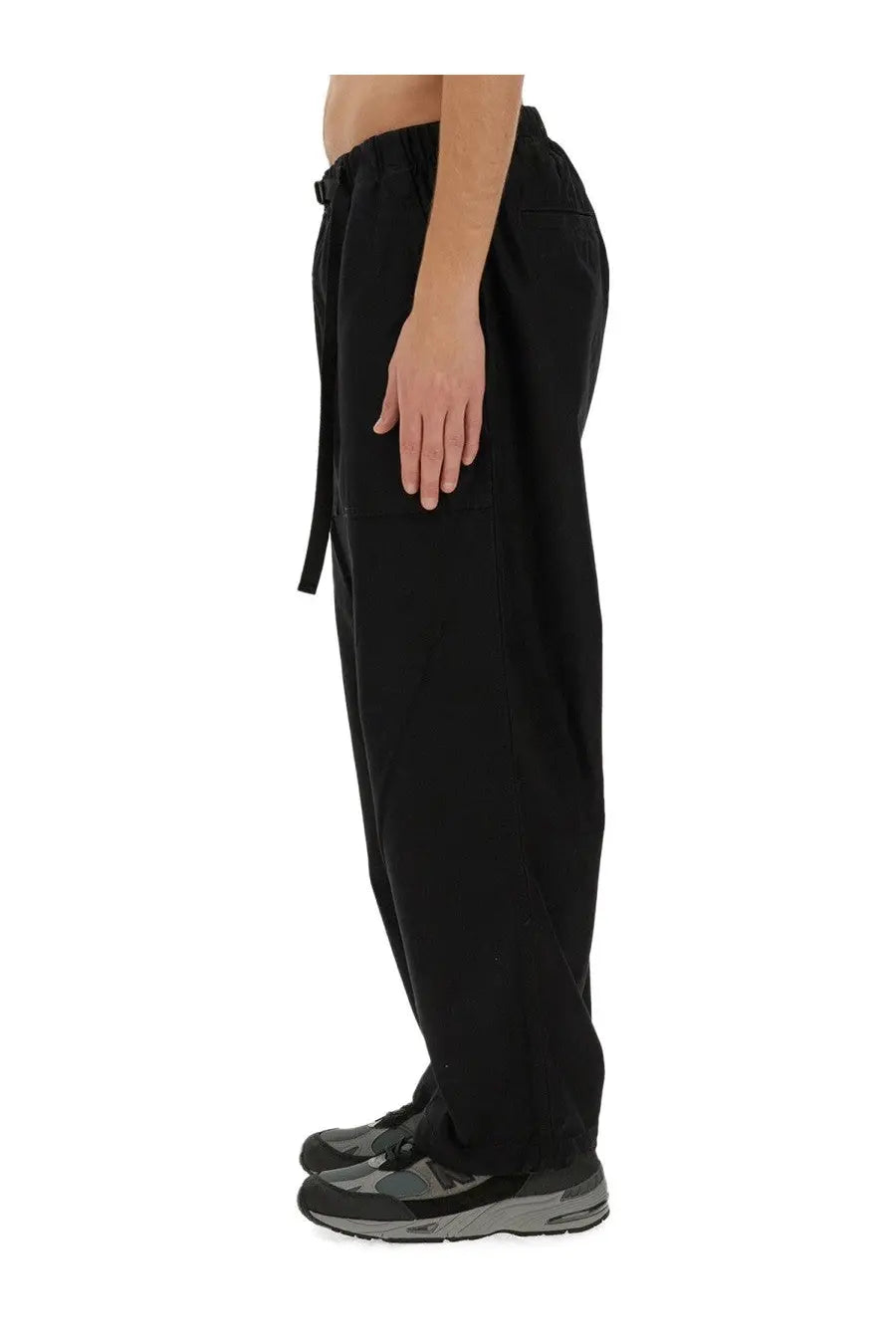Carhartt Wip men’s black drawstring belt pants with relaxed tapered fit and subtle side pockets